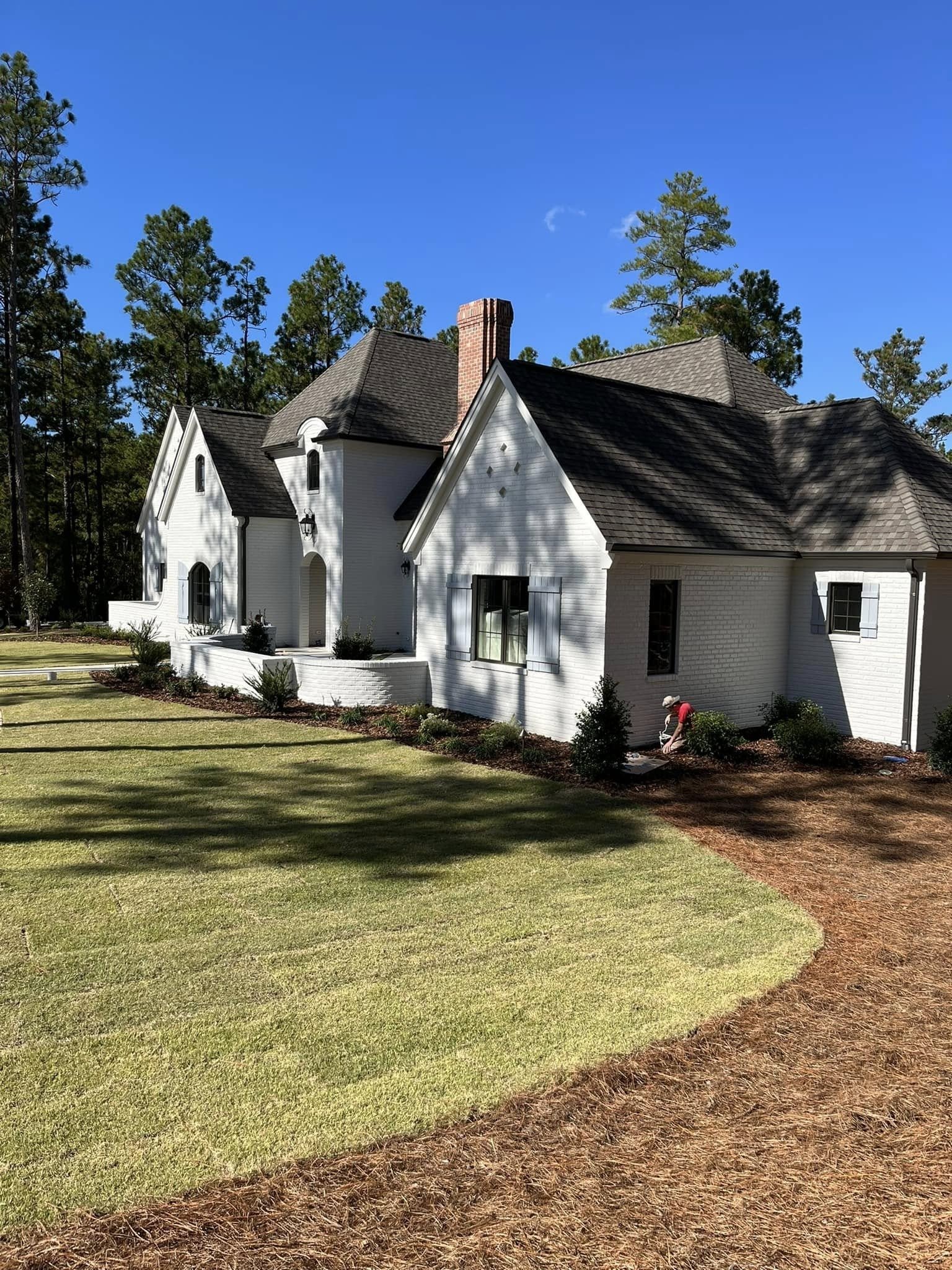 Completed exterior with fresh landscaping
